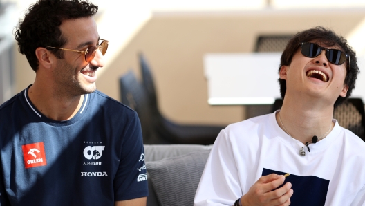 ABU DHABI, UNITED ARAB EMIRATES - NOVEMBER 23: Daniel Ricciardo of Australia and Scuderia AlphaTauri and Yuki Tsunoda of Japan and Scuderia AlphaTauri talk to the media during previews ahead of the F1 Grand Prix of Abu Dhabi at Yas Marina Circuit on November 23, 2023 in Abu Dhabi, United Arab Emirates. (Photo by Peter Fox/Getty Images)