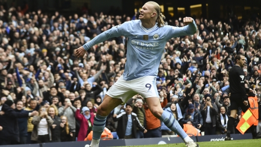 Manchester City's Erling Haaland celebrates with after scoring his side's second goal during the English Premier League soccer match between Manchester City and and Everton, at the Etihad stadium in Manchester, England, Saturday, February 10, 2024. (AP Photo/Rui Viera)