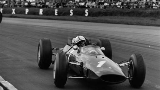 15th May 1965:  Racing driver John Surtees competing in an International Trophy Race in a Ferrari formula one car at Silverstone. Earlier in the day, a loose wheel from a skidding car had deprived him of possible victory in the 75 mile sports car race. He had been disputing the lead with Bruce McLaren at the time.  (Photo by Ted West/Central Press/Getty Images)