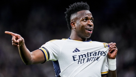 Real Madrid's Vinicius Junior celebrates after scoring the opening goal during a Spanish La Liga soccer match between Real Madrid and Girona at the Santiago Bernabeu stadium in Madrid, Spain, Saturday, Feb. 10, 2024. (AP Photo/Manu Fernandez)