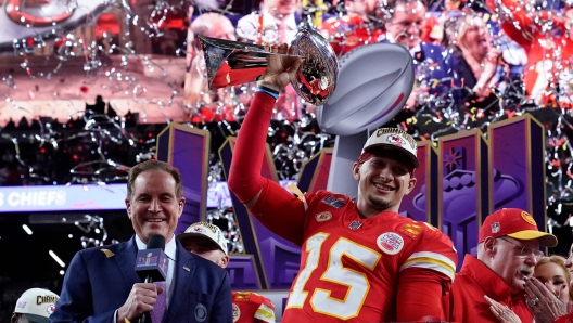 Kansas City Chiefs' quarterback #15 Patrick Mahomes celebrates with the trophy after the Chiefs won Super Bowl LVIII against the San Francisco 49ers at Allegiant Stadium in Las Vegas, Nevada, February 11, 2024. (Photo by TIMOTHY A. CLARY / AFP)