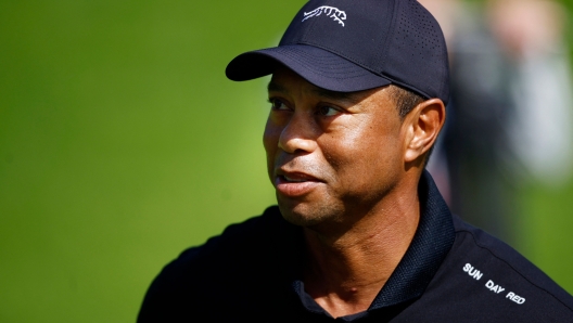 PACIFIC PALISADES, CALIFORNIA - FEBRUARY 13: Tiger Woods of the United States looks on as he practices prior to The Genesis Invitational at Riviera Country Club on February 13, 2024 in Pacific Palisades, California.   Ronald Martinez/Getty Images/AFP (Photo by RONALD MARTINEZ / GETTY IMAGES NORTH AMERICA / Getty Images via AFP)