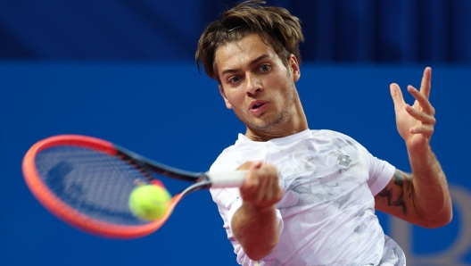 Italy's Flavio Cobolli returns the ball to France's Constant Lestienne during their singles tennis match at the Open Sud de France ATP World Tour in Montpellier, southern France, on February 1, 2024. (Photo by Pascal GUYOT / AFP)