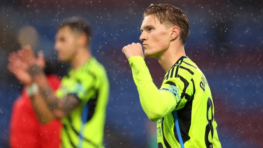 BURNLEY, ENGLAND - FEBRUARY 17: Martin Odegaard of Arsenal celebrates after the team's victory following the Premier League match between Burnley FC and Arsenal FC at Turf Moor on February 17, 2024 in Burnley, England. (Photo by Marc Atkins/Getty Images)