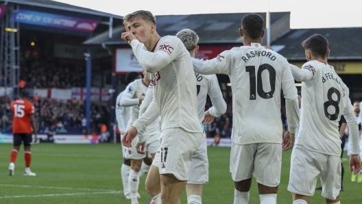 Manchester United's Rasmus Hojlund celebrates after scoring his side's opening goal during the English Premier League soccer match between Luton Town and Manchester United at Kenilworth Road, in Luton, England, Sunday, Feb. 18, 2024. (AP Photo/Ian Walton)