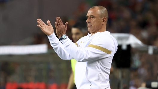 Slovakia coach Francesco Calzona claps his hands during the Euro 2024 group J qualifying soccer match between Portugal and Slovakia at the Dragao stadium in Porto, Portugal, Friday, Oct. 13, 2023. (AP Photo/Luis Vieira)