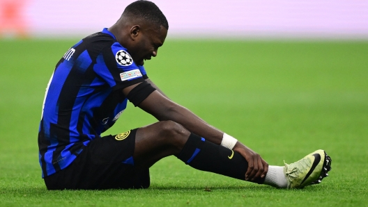 Inter Milan's French forward #09 Marcus Thuram reacts during the UEFA Champions League last 16 first leg football match Inter Milan vs Atletico Madrid at the San Siro stadium in Milan on February 20, 2024. (Photo by Marco BERTORELLO / AFP)