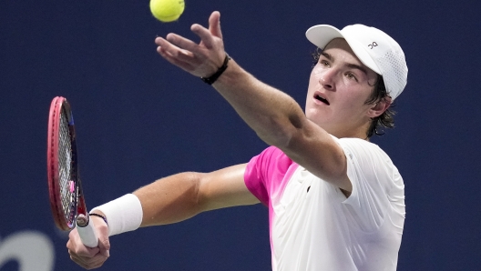 Joao Fonseca, of Brazil, serves to Learner Tien, of the United States, during the boys' singles final of the U.S. Open tennis championships, Saturday, Sept. 9, 2023, in New York. (AP Photo/Charles Krupa)