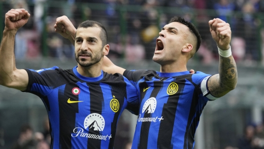 Inter Milan's Lautaro Martinez, right, celebrates with Henrikh Mkhitaryan after scoring the opening goal during the Serie A soccer match between Inter Milan and Hellas Verona at the San Siro Stadium in Milan, Italy, Saturday, Jan. 6, 2024. (AP Photo/Antonio Calanni)