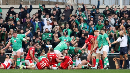 Ireland players celebrate the opening try by Ireland's hooker Dan Sheehan during the Six Nations international rugby union match between Ireland and Wales at the Aviva Stadium in Dublin, on February 24, 2024. (Photo by Paul Faith / AFP)