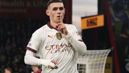 Manchester City's English midfielder #47 Phil Foden celebrates after scoring the opening goal of the English Premier League football match between Bournemouth and Manchester City at the Vitality Stadium in Bournemouth, southern England on February 24, 2024. (Photo by Adrian DENNIS / AFP) / RESTRICTED TO EDITORIAL USE. No use with unauthorized audio, video, data, fixture lists, club/league logos or 'live' services. Online in-match use limited to 120 images. An additional 40 images may be used in extra time. No video emulation. Social media in-match use limited to 120 images. An additional 40 images may be used in extra time. No use in betting publications, games or single club/league/player publications. /