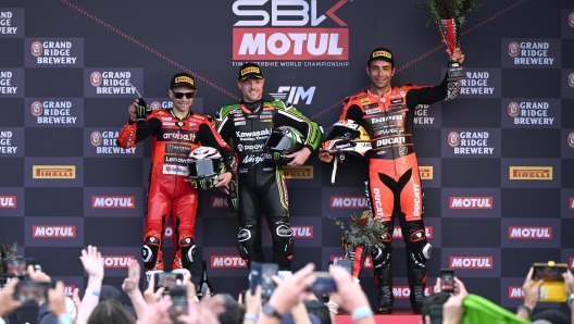 epa11179907 British rider Alex Lowes of Kawasaki Racing Team WorldSBK (C) celebrates winning WorldSBK Race Two of the Superbike World Championship along side Spanish rider Alvaro Bautista of Aruba.it Racing Ducati team (L) and Italian rider Danilo Petrucci of BARNI Spark Racing Team on Phillip Island, Victoria,  Australia, 25 February 2024.  EPA/JOEL CARRETT NO ARCHIVING, EDITORIAL USE ONLY AUSTRALIA AND NEW ZEALAND OUT