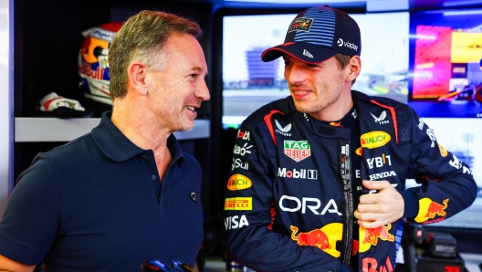 BAHRAIN, BAHRAIN - FEBRUARY 21: Max Verstappen of the Netherlands and Oracle Red Bull Racing talks with Red Bull Racing Team Principal Christian Horner in the garage during day one of F1 Testing at Bahrain International Circuit on February 21, 2024 in Bahrain, Bahrain. (Photo by Mark Thompson/Getty Images)