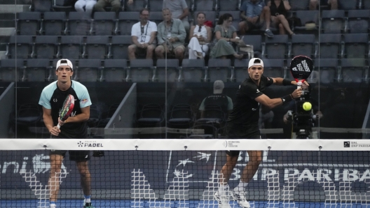 Spaniards Juan Lebron, left Alejandro Galan compete against compatriots Antonio Fernandez and Pablo Corona at the Italy Major Premier Padel tournament in Rome, Wednesday, July 12, 2023. A successful debut at the European Games with matches played before enthusiastic crowds in Krakow's central square last month. Record prize money of nearly $1 million at this week's tournament in Rome. Padel, the fastest growing racket sport in the world among amateurs, is also making big strides at the professional level. (AP Photo/Gregorio Borgia)