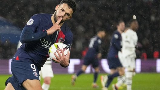 PSG's Goncalo Ramos celebrates after scoring his side's opening goal from penalty spot during the French League One soccer match between Paris Saint-Germain and Rennes, at the Parc des Princes stadium in Paris, France, Sunday, Feb. 25, 2024. (AP Photo/Michel Euler)