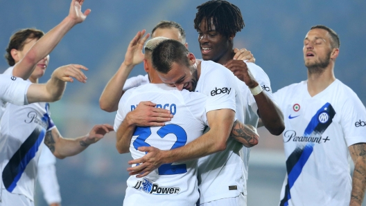 Inter Milan's Dutch defender #06 Stefan de Vrij celebrates with teammate Inter Milan's Italian defender #32 Federico Dimarco after scoring during the Italian Serie A football match between Lecce and Inter Milan at the Ettore Giardiniero stadium in Lecce, on February 25, 2024. (Photo by Carlo Hermann / AFP)