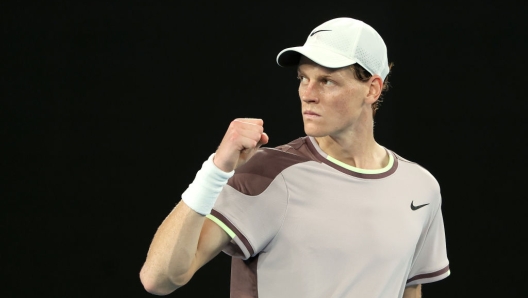 MELBOURNE, AUSTRALIA - JANUARY 28: Jannik Sinner of Italy celebrates winning the fourth set during their Men's Singles Final match against Daniil Medvedev during the 2024 Australian Open at Melbourne Park on January 28, 2024 in Melbourne, Australia. (Photo by Cameron Spencer/Getty Images)