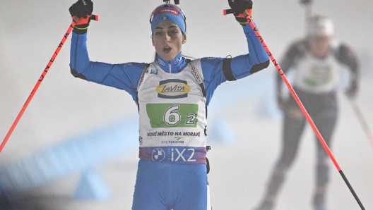 Italy's Lisa Vittozzi reacts in the finish area of the single mixed relay event of the IBU Biathlon World Championships in Nove Mesto, Czech Republic on February 15, 2024. (Photo by Joe Klamar / AFP)