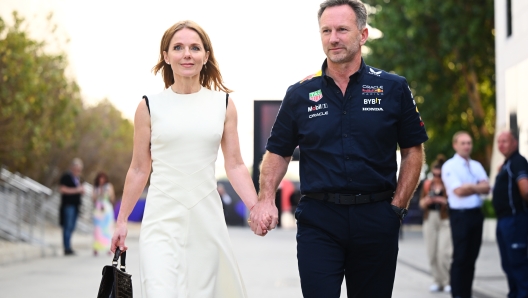 BAHRAIN, BAHRAIN - MARCH 02: Oracle Red Bull Racing Team Principal Christian Horner and Geri Horner walk in the Paddock holding hands prior to the F1 Grand Prix of Bahrain at Bahrain International Circuit on March 02, 2024 in Bahrain, Bahrain. (Photo by Clive Mason/Getty Images)