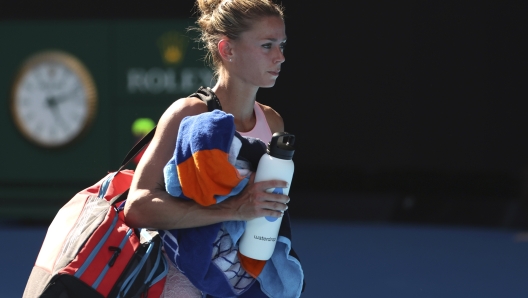 Camila Giorgi of Italy walks from the court following her first round loss to Victoria Azarenka of Belarus at the Australian Open tennis championships at Melbourne Park, Melbourne, Australia, Tuesday, Jan. 16, 2024. (AP Photo/Asanka Brendon Ratnayake)