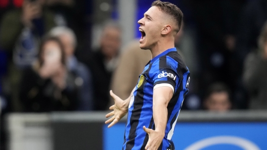 Inter Milan's Kristjan Asllani celebrates after scoring against Genoa during a Serie A soccer match between Inter Milan and Genoa at the San Siro stadium in Milan, Italy, Monday, March 4, 2024. (AP Photo/Luca Bruno)