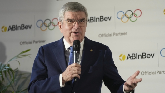 President of the IOC Thomas Bach attends a news conference in London, Friday, Jan. 12, 2024. The International Olympic Committee has signed Anheuser-Busch InBev as the first beer brand in the 40-year history of its sponsorship program, which earns billions of dollars for the organization and international sports. (AP Photo/Kin Cheung)