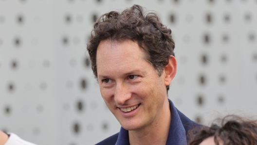 Ferrari's Chairman and CEO John Elkann walks in the paddocks ahead of the Saudi Arabian Formula One Grand Prix at the Jeddah Corniche Circuit in Jeddah on March 9, 2024. (Photo by Giuseppe CACACE / AFP)