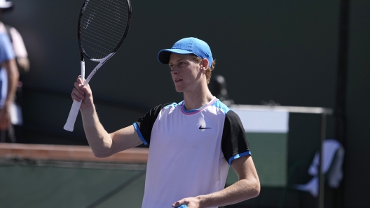 Jannik Sinner, of Italy, waves after defeating Thanasi Kokkinakis, of Australia, at the BNP Paribas Open tennis tournament in Indian Wells, Calif., Friday, March 8, 2024. (AP Photo/Mark J. Terrill)