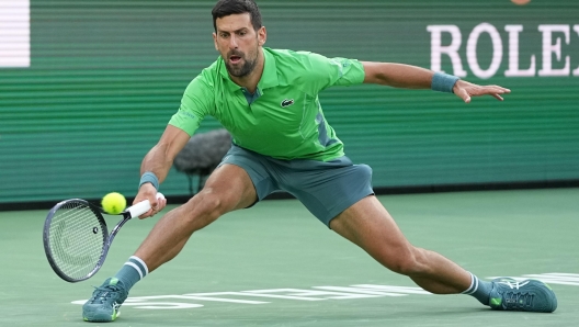 epa11210342 Novak Djokovic of Serbia in action against Aleksandar Vukic of Australia during the BNP Paribas Open tennis tournament in Indian Wells, California, USA, 09 March 2024.  EPA/RAY ACEVEDO