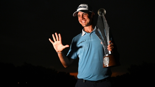 JOHANNESBURG, SOUTH AFRICA - MARCH 10: Matteo Manassero of Italy is awarded the trophy as he celebrates victory following day four of the Jonsson Workwear Open at Glendower Golf Club on March 10, 2024 in Johannesburg, South Africa. (Photo by Stuart Franklin/Getty Images)