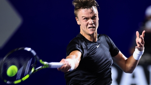 epa11190056 Holger Rune of Denmark in action against Dominik Koepfer of Germany during their quarter final match at the Mexican Tennis Open, in Acapulco state of Guerrero, Mexico 29 February 2024.  EPA/David Guzman