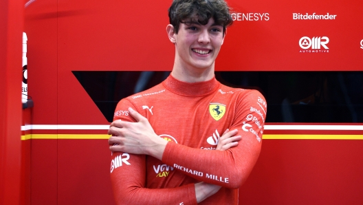 JEDDAH, SAUDI ARABIA - MARCH 09: 7th placed Oliver Bearman of Great Britain and Ferrari looks on in the pits prior to competing in the F1 Grand Prix of Saudi Arabia at Jeddah Corniche Circuit on March 09, 2024 in Jeddah, Saudi Arabia. (Photo by Clive Rose/Getty Images)