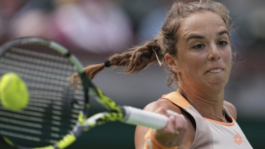 Lucia Bronzetti, of Italy, returns a shot to Coco Gauff, of the United States, at the BNP Paribas Open tennis tournament Monday, March 11, 2024, in Indian Wells, Calif. (AP Photo/Mark J. Terrill)