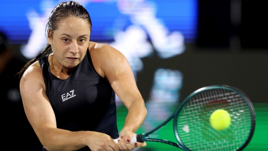 DUBAI, UNITED ARAB EMIRATES - FEBRUARY 20: Elisabetta Cocciaretto of Italy plays a backhand against Coco Gauff of the United States in their second round women's singles match during the Dubai Duty Free Tennis Championships, part of the Hologic WTA Tour at Dubai Duty Free Tennis Stadium on February 20, 2024 in Dubai, United Arab Emirates. (Photo by Christopher Pike/Getty Images)