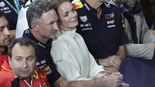 Red Bull team principal Christian Horner is flanked by his wife Geri Alliwell after the Formula One Saudi Arabian Grand Prix at the Jeddah Corniche Circuit, in Jedda, Saudi Arabia, Saturday, March 9, 2024. (AP Photo/Giuseppe Cacace/Pool)