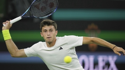 Luca Nardi, of Italy, returns a shot Novak Djokovic, of Serbia, at the BNP Paribas Open tennis tournament Monday, March 11, 2024, in Indian Wells, Calif. Nardi won 6-4, 3-6, 6-3. (AP Photo/Mark J. Terrill)