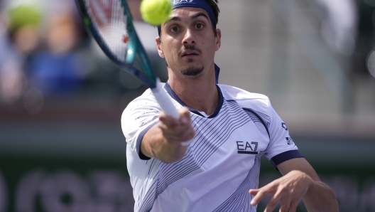 Lorenzo Sonego, of Italy, returns to Cameron Norrie, of Great Britain, at the BNP Paribas Open tennis tournament, Saturday, March 9, 2024, in Indian Wells, Calif. (AP Photo/Ryan Sun)