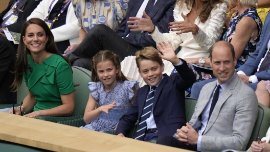 Kate, Princess of Wales, Princess Charlotte, Prince George and Britain's Prince William sit in the Royal Box on Centre Court for the final of the men's singles between Spain's Carlos Alcaraz and Serbia's Novak Djokovic on day fourteen of the Wimbledon tennis championships in London, Sunday, July 16, 2023. (AP Photo/Alastair Grant)