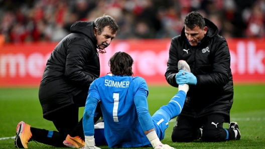 COPENHAGEN, DENMARK - MARCH 23: Yann Sommer of Switzerland receives medical treatment during the international friendly match between Denmark and Switzerland at Parken Stadium on March 23, 2024 in Copenhagen, Denmark. (Photo by Stuart Franklin/Getty Images)