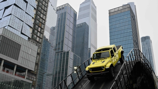 A Jeep Wrangler Rubicon drives on an outdoor track during a press preview at the New York International Auto Show at the Jacob Javits Convention Center in New York City on March 27, 2024. (Photo by ANGELA WEISS / AFP)