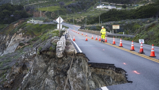 Cones mark a break in the southbound lane of Highway 1 at Rocky Creek Bridge in Big Sur, Calif., Monday, April 1, 2024, following an Easter weekend storm. (AP Photo/Nic Coury)