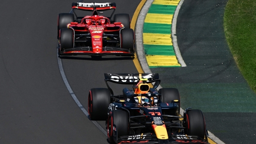 Red Bull Racing's Mexican driver Sergio Perez (front) and Ferrari's Monegasque driver Charles Leclerc drive during the first practice session of the Formula One Australian Grand Prix at the Albert Park Circuit in Melbourne on March 22, 2024. (Photo by Paul Crock / AFP) / -- IMAGE RESTRICTED TO EDITORIAL USE - STRICTLY NO COMMERCIAL USE --