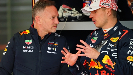 SUZUKA, JAPAN - APRIL 05: Oracle Red Bull Racing Team Principal Christian Horner and Max Verstappen of the Netherlands and Oracle Red Bull Racing talk in the garage during practice ahead of the F1 Grand Prix of Japan at Suzuka International Racing Course on April 05, 2024 in Suzuka, Japan. (Photo by Clive Mason/Getty Images)