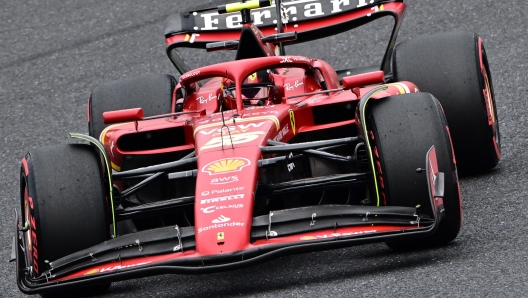 Ferrari's Spanish driver Carlos Sainz Jr takes a corner during the first practice session ahead of the Formula One Japanese Grand Prix race at the Suzuka circuit in Suzuka, Mie prefecture on April 5, 2024. (Photo by Philip FONG / AFP)