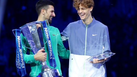 TURIN, ITALY - NOVEMBER 19: Novak Djokovic (L) of Serbia and Jannik Sinner of Italy react following the Men's Singles Finals between Jannik Sinner of Italy and Novak Djokovic of Serbia on day eight of the Nitto ATP Finals at Pala Alpitour on November 19, 2023 in Turin, Italy. (Photo by Clive Brunskill/Getty Images)