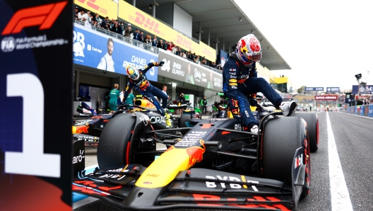 SUZUKA, JAPAN - APRIL 06: Pole position qualifier Max Verstappen of the Netherlands and Oracle Red Bull Racing climbs from his car in parc ferme during qualifying ahead of the F1 Grand Prix of Japan at Suzuka International Racing Course on April 06, 2024 in Suzuka, Japan. (Photo by Mark Thompson/Getty Images)