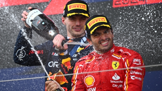 SUZUKA, JAPAN - APRIL 07: Race winner Max Verstappen of the Netherlands and Oracle Red Bull Racing and Third placed Carlos Sainz of Spain and Ferrari celebrate on the podium during the F1 Grand Prix of Japan at Suzuka International Racing Course on April 07, 2024 in Suzuka, Japan. (Photo by Clive Mason/Getty Images)