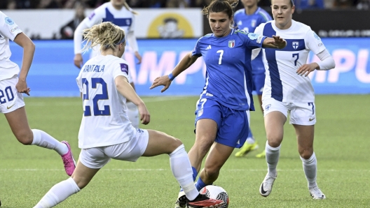 Finland's Jutta Rantala, left, and Italy's Sofia Cantore battle for the ball during the women's European League qualifying soccer match between Finland and Italy in Helsinki, Finland, Tuesday April 9, 2024. (Heikki Saukkomaa/Lehtikuva via AP)