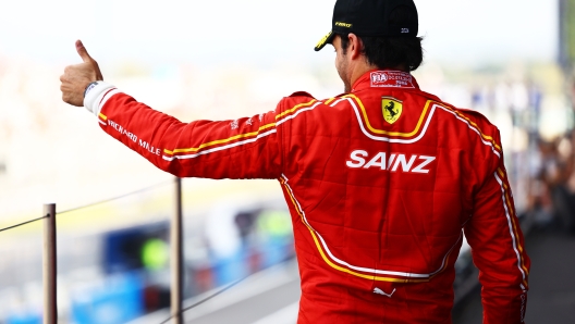 SUZUKA, JAPAN - APRIL 07: Third placed Carlos Sainz of Spain and Ferrari celebrates on the podium during the F1 Grand Prix of Japan at Suzuka International Racing Course on April 07, 2024 in Suzuka, Japan. (Photo by Mark Thompson/Getty Images)