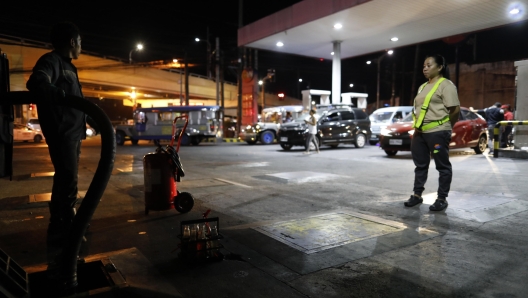 epa11129448 A laborer delivers diesel as fuel prices are expected to rise, at a station in Manila, Philippines, 05 February 2024. Motorists in the Philippines will see another increase of petroleum products prices effective from 06 February, which the Philippines' Department of Energy Oil Industry Management Bureau said was due to disruption of supplies and proposed extension of the Organization of the Petroleum Exporting Countries (OPEC) cuts by 2.2 million barrels per day until the first quarter of 2024.  EPA/FRANCIS R. MALASIG